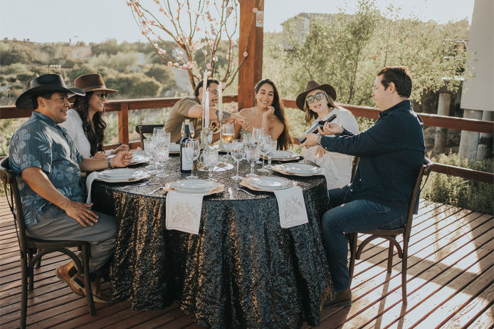 Couple enjoying wine tasting in Valle de Guadalupe from San Diego