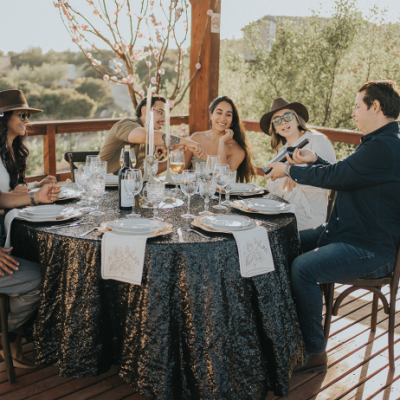Couple enjoying wine tasting in Valle de Guadalupe from San Diego