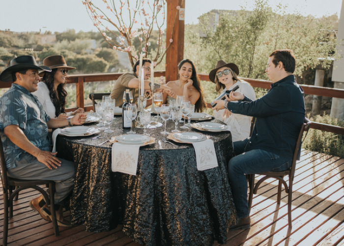 Couple enjoying wine tasting in Valle de Guadalupe from San Diego